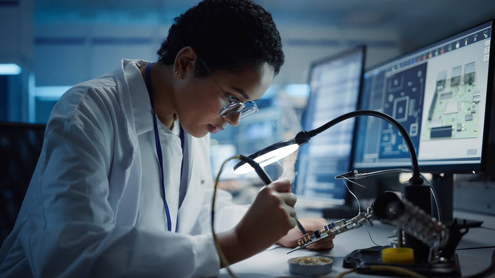 Engineer removing Parylene coating