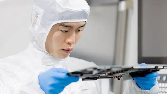 hzo-engineer-examining-circtuit-board